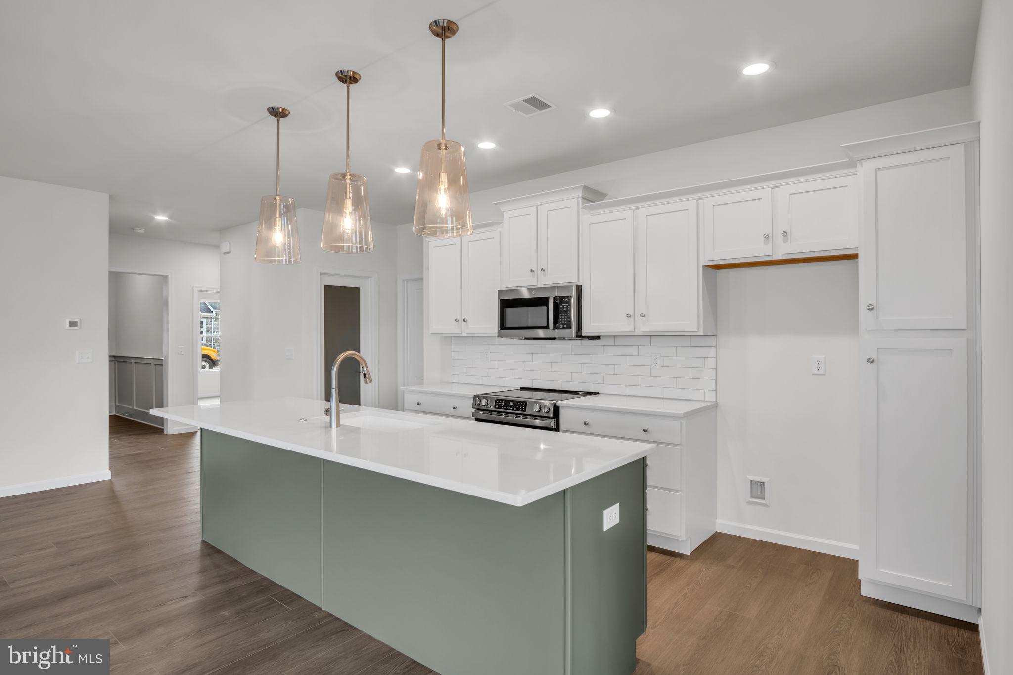 862 Shadowbrooke Dover, PA 17315 - Photo 3 of 10 a view of a kitchen with kitchen island a sink stainless steel appliances and cabinets