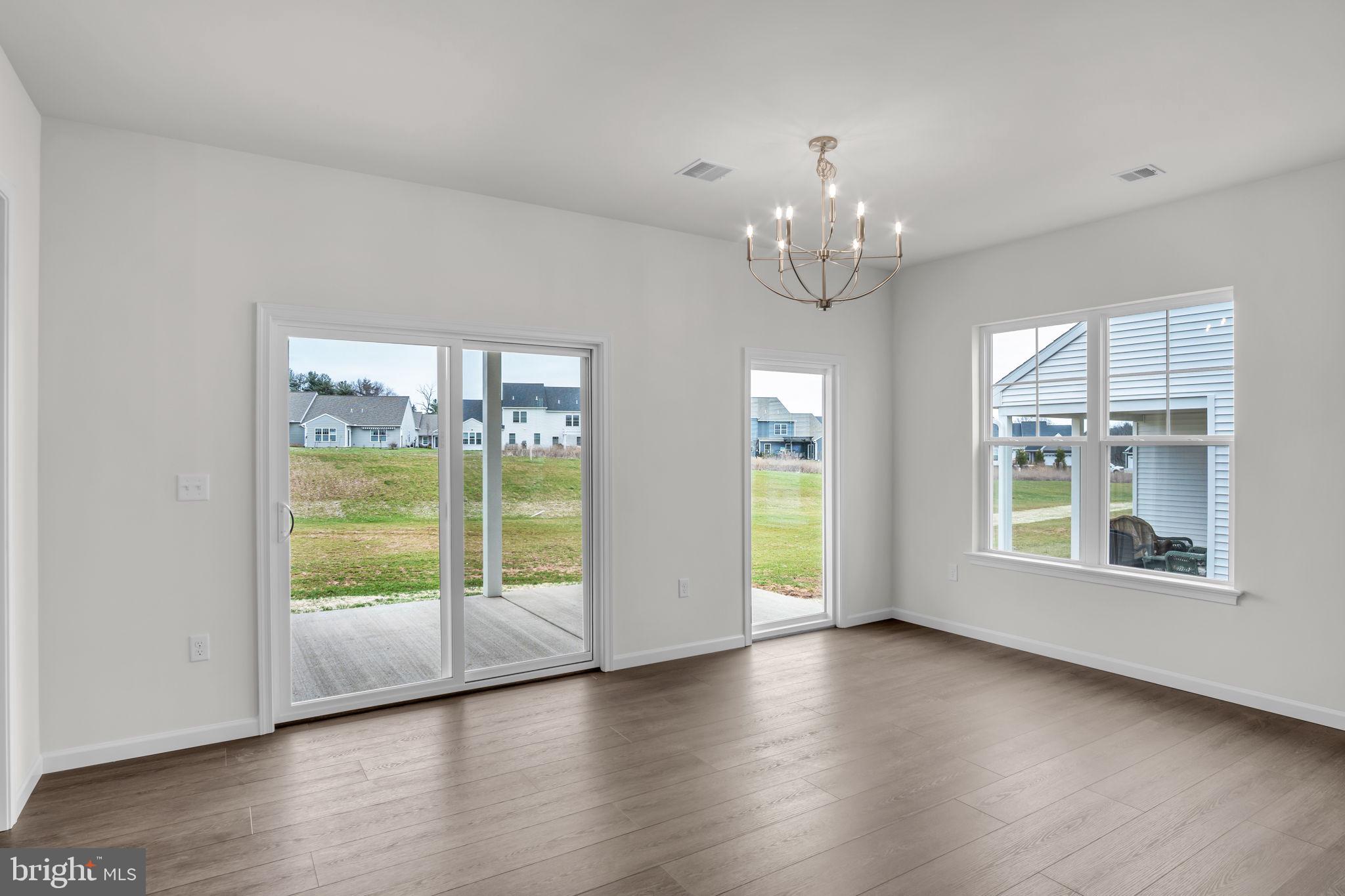 862 Shadowbrooke Dover, PA 17315 - Photo 6 of 10 a view of an empty room with wooden floor and a window