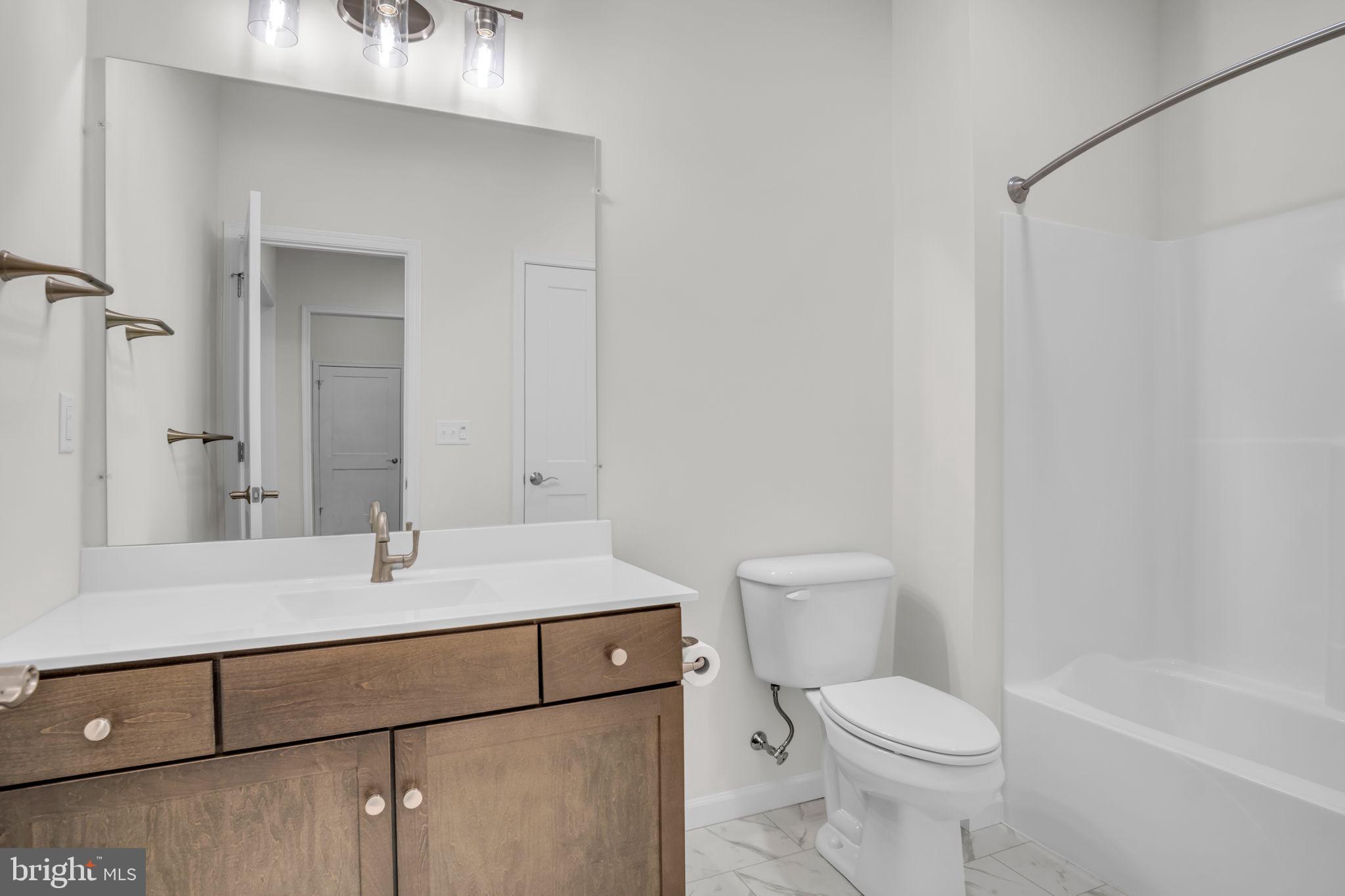 862 Shadowbrooke Dover, PA 17315 - Photo 10 of 10 a bathroom with a sink a toilet and shower