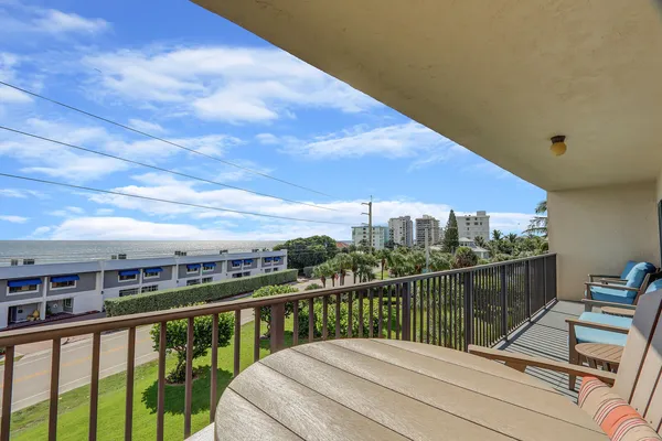 a view of a balcony with city view