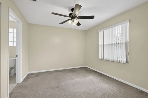 a view of a house with yard and trees
