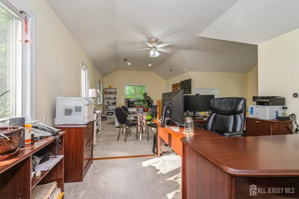 a room with furniture a dining table and chairs