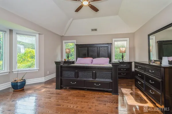 a bed room with a bed and a television
