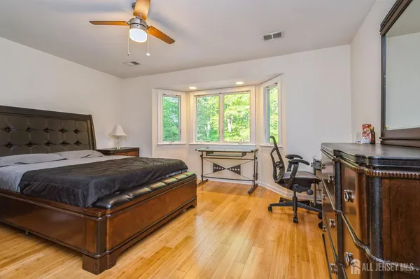 a bedroom with a bed and a table