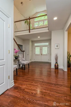 a view of living room filled with furniture and wooden floor