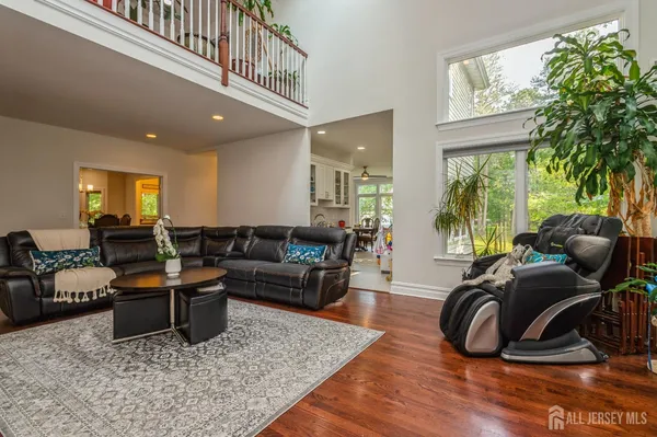 a living room with furniture rug and a large window