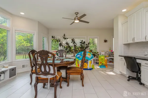 a view of a dining room with furniture window and outdoor view