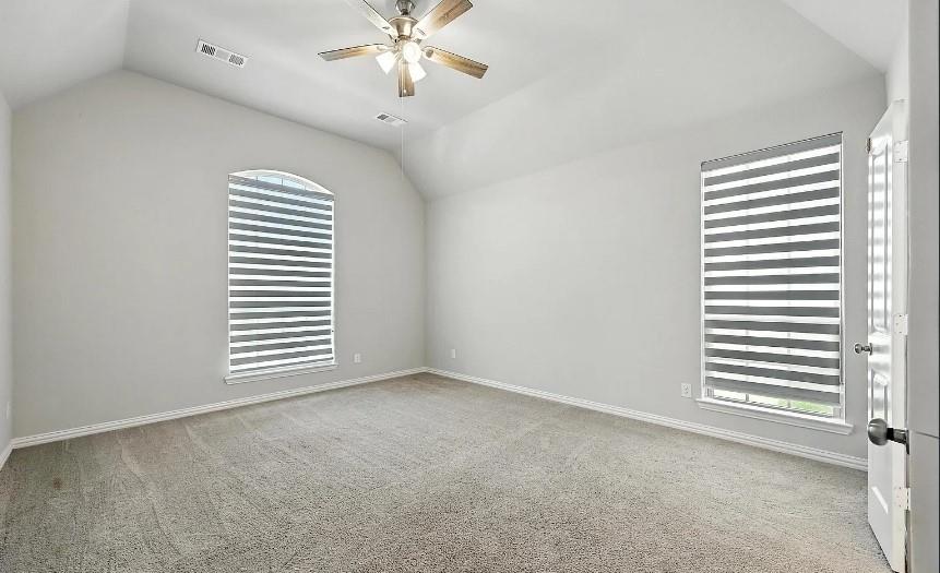 12559 Ravine Creek Road Frisco, TX 75035 - Photo 16 of 33 Spare room with a ceiling fan and light colored carpet