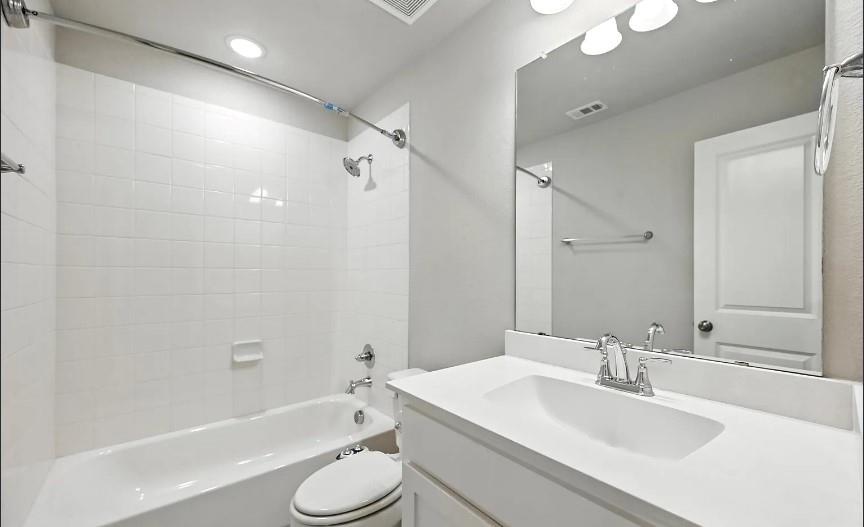 12559 Ravine Creek Road Frisco, TX 75035 - Photo 18 of 33 Bathroom featuring vanity and bathing tub / shower combination