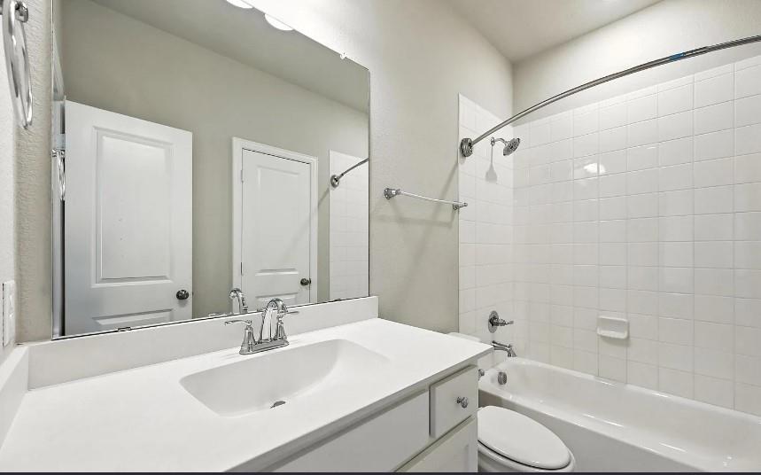 12559 Ravine Creek Road Frisco, TX 75035 - Photo 19 of 33 Bathroom featuring vanity and bathtub / shower combination