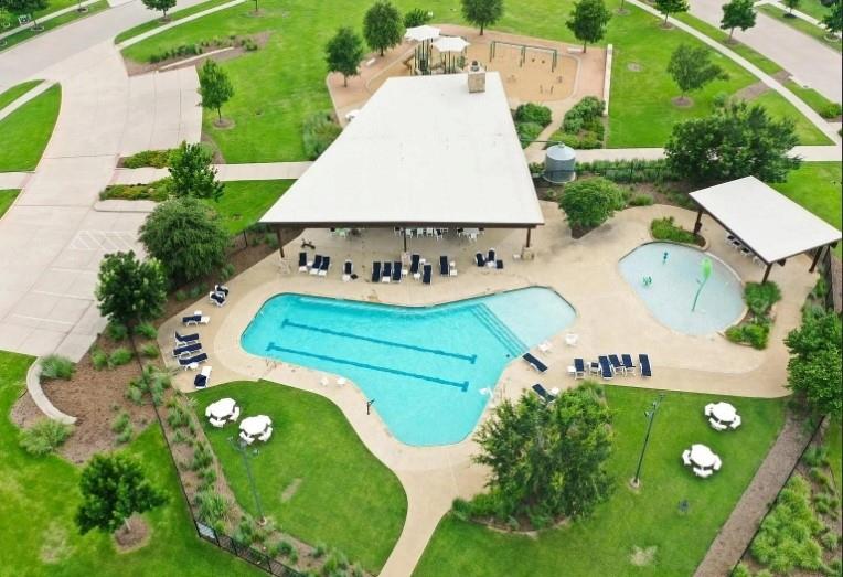 12559 Ravine Creek Road Frisco, TX 75035 - Photo 29 of 33 Community pool with a patio and a lawn