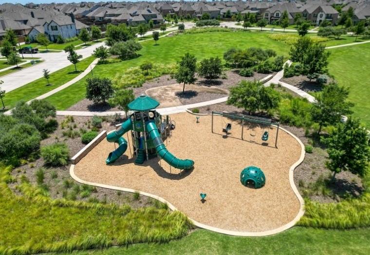 12559 Ravine Creek Road Frisco, TX 75035 - Photo 32 of 33 Community play area with a residential view and a yard