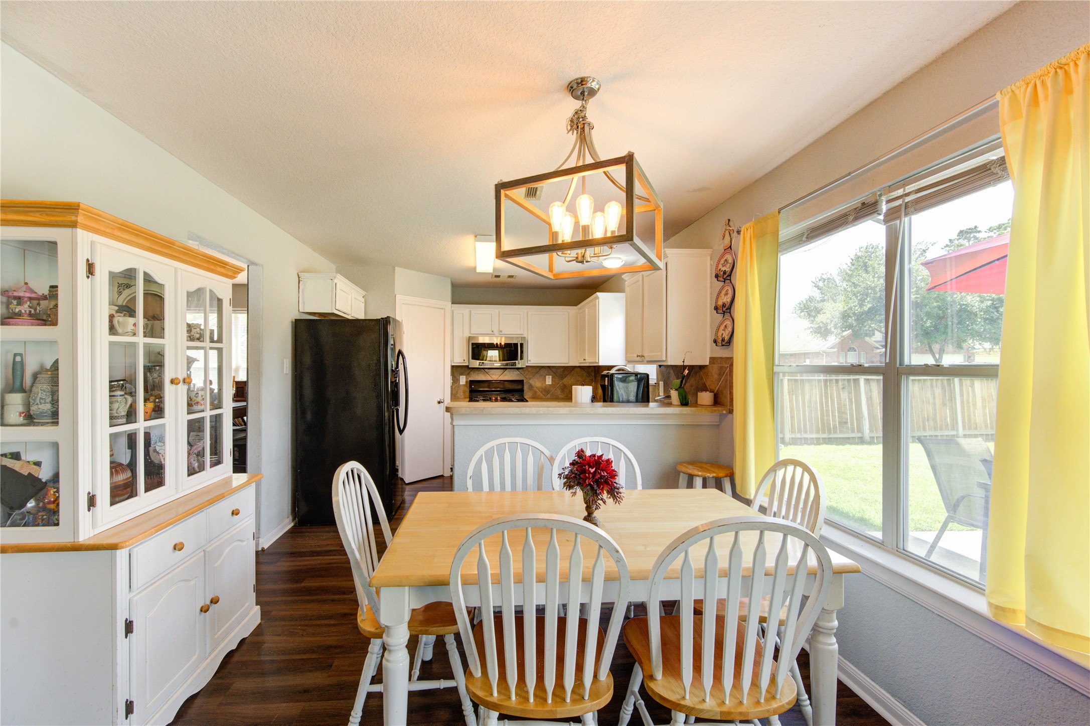 19103 Crystola Park Spring, TX 77373 - Photo 13 of 49 a view of a dining room with furniture a chandelier and a window