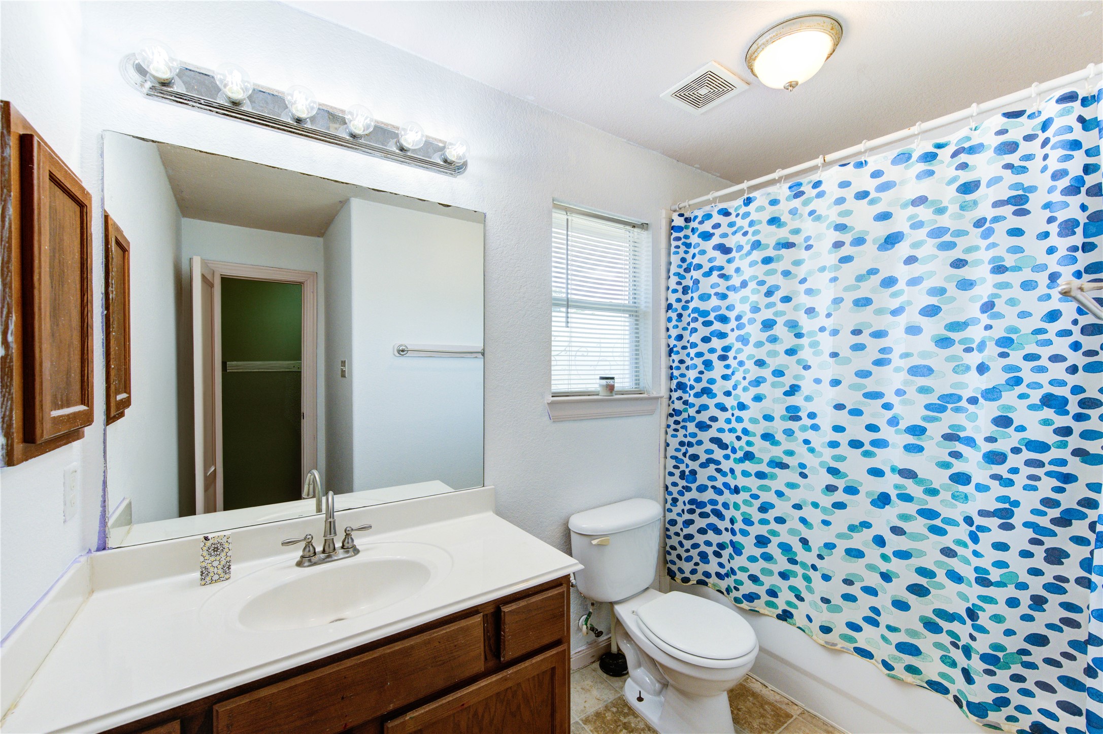 19103 Crystola Park Spring, TX 77373 - Photo 34 of 49 a bathroom with a sink a toilet a shower and a mirror