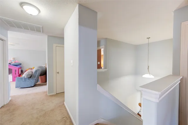 a view of livingroom and bedroom with furniture