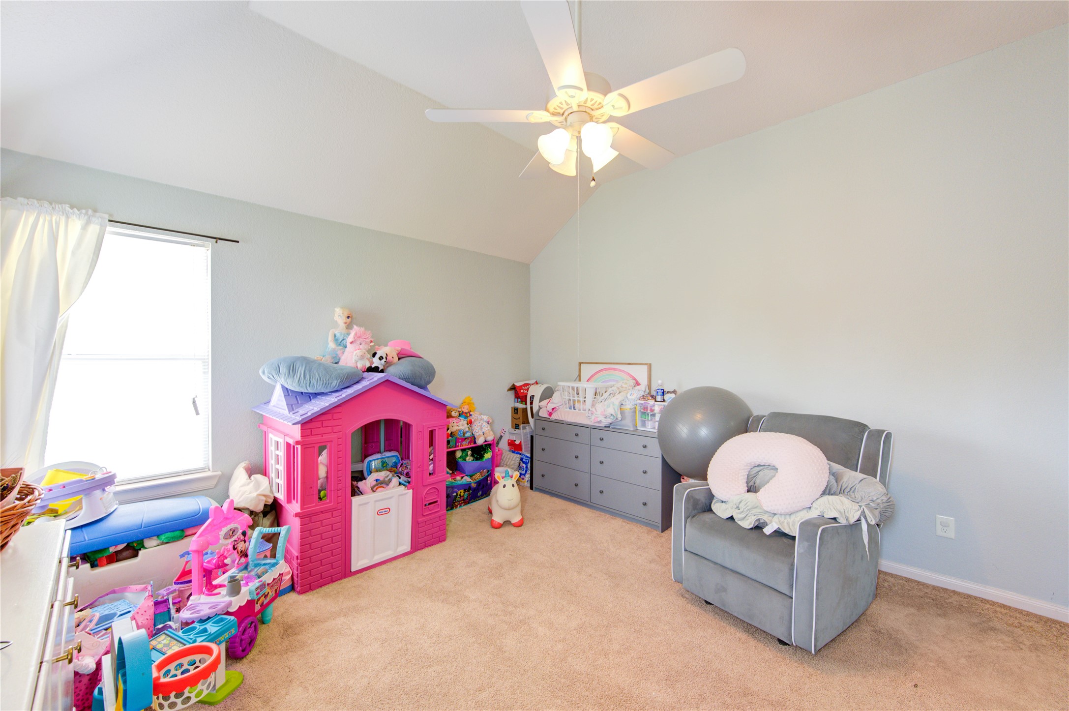 19103 Crystola Park Spring, TX 77373 - Photo 40 of 49 a bedroom with bed and a chandelier