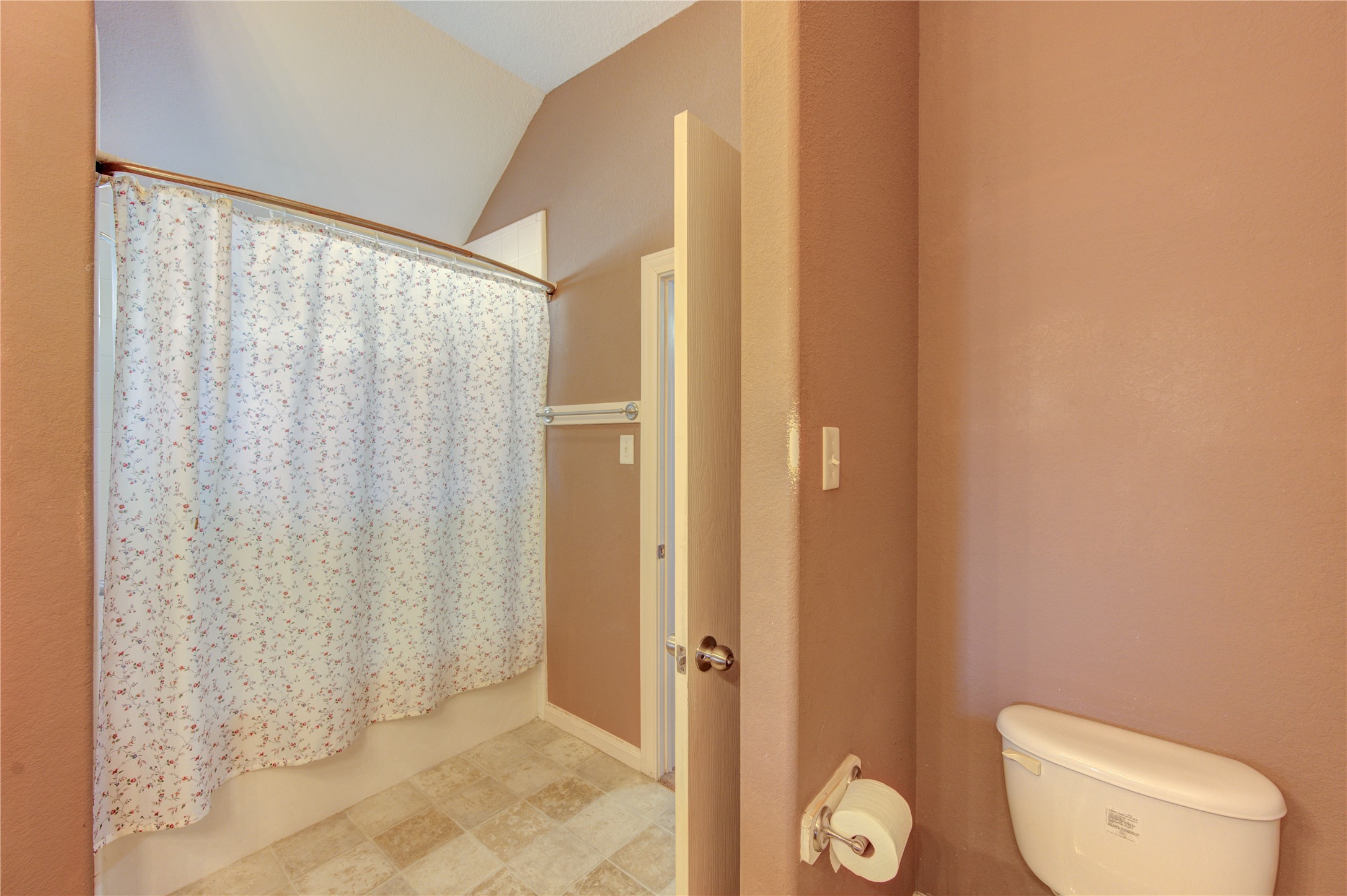 19103 Crystola Park Spring, TX 77373 - Photo 42 of 49 a bathroom with a toilet and a shower curtain