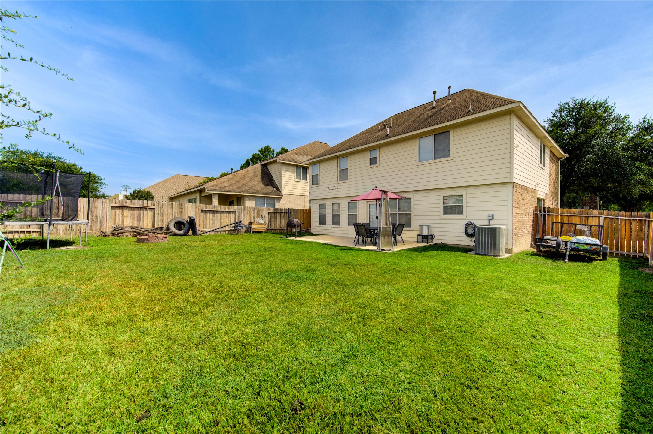 19103 Crystola Park Spring, TX 77373 - Photo 46 of 49 a view of a white house with a big yard and large trees