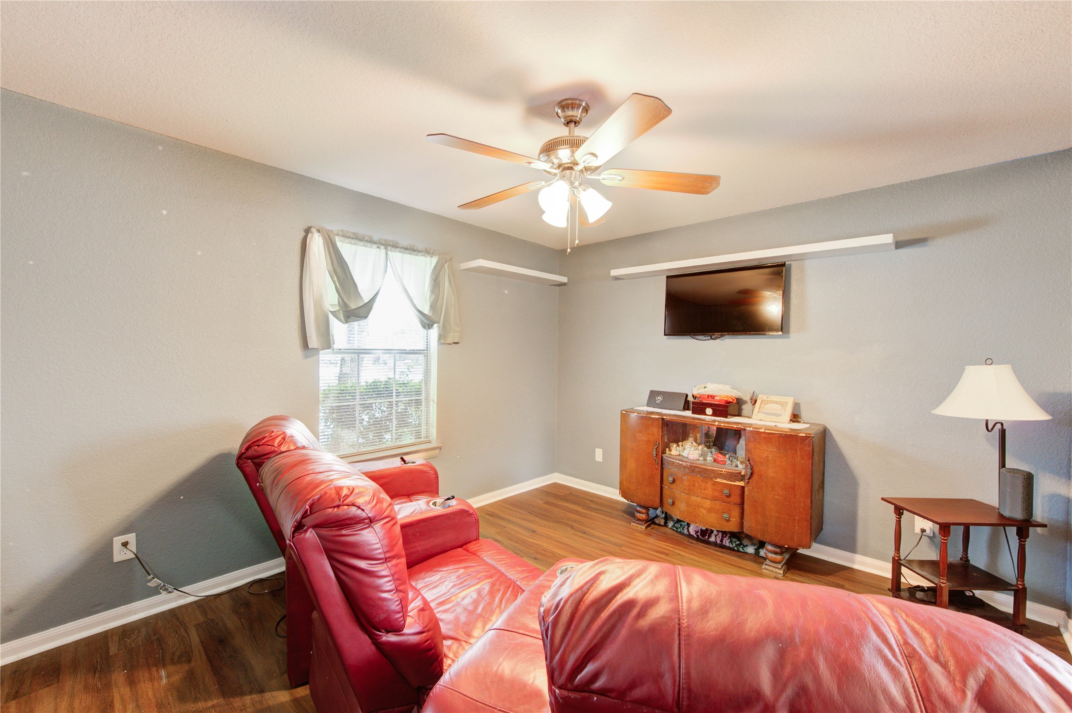 19103 Crystola Park Spring, TX 77373 - Photo 7 of 49 a bedroom with a bed and a chandelier