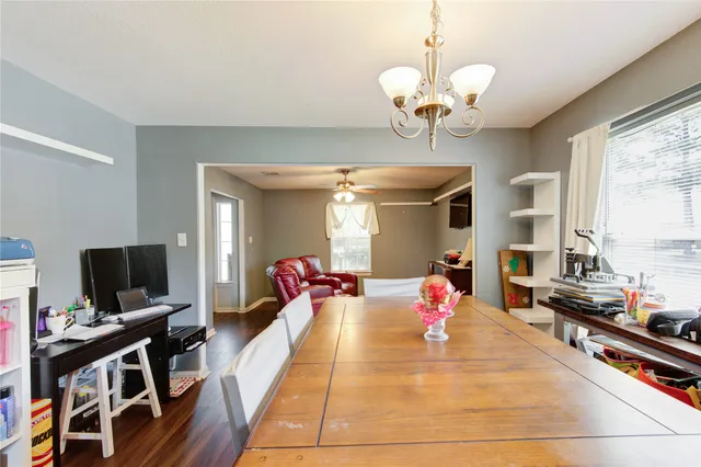 a bedroom with bed and flat screen tv