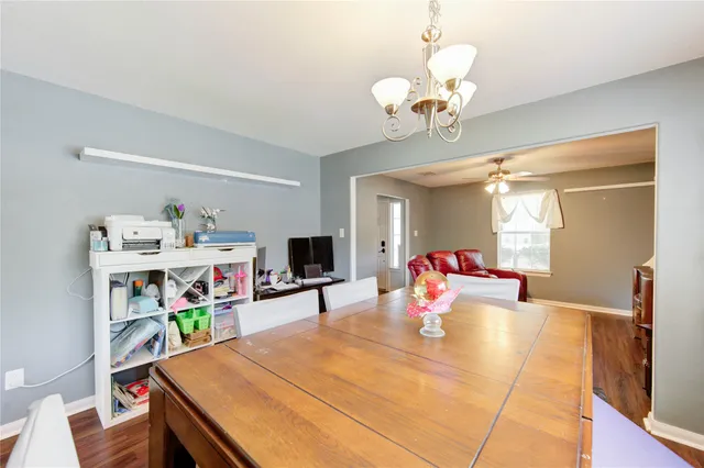 a living room with dining table