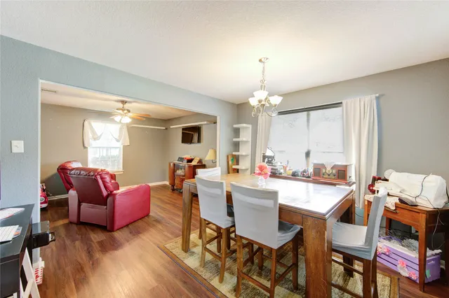 a view of a livingroom with furniture and a chandelier