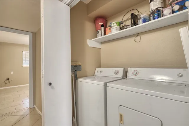 a view of storage and utility room with washer and dryer