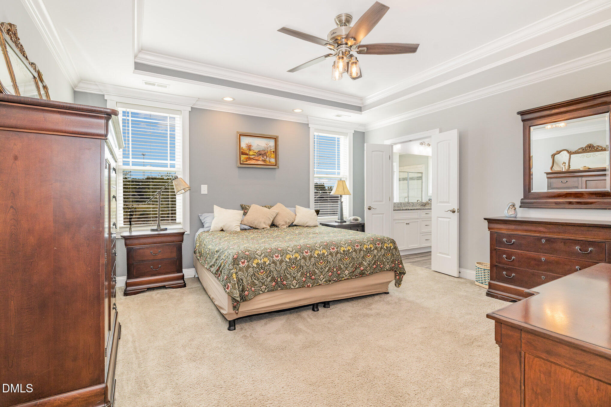 17 Kiowa Court Willow Spring, NC 27592 - Photo 10 of 27 a bedroom with a large bed and a chandelier