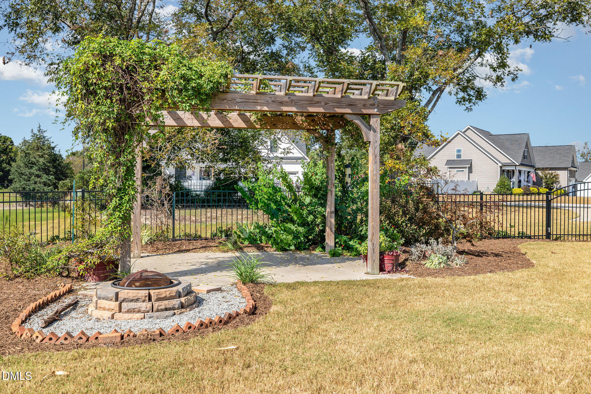 17 Kiowa Court Willow Spring, NC 27592 - Photo 25 of 27 a view of a house with a yard and potted plants