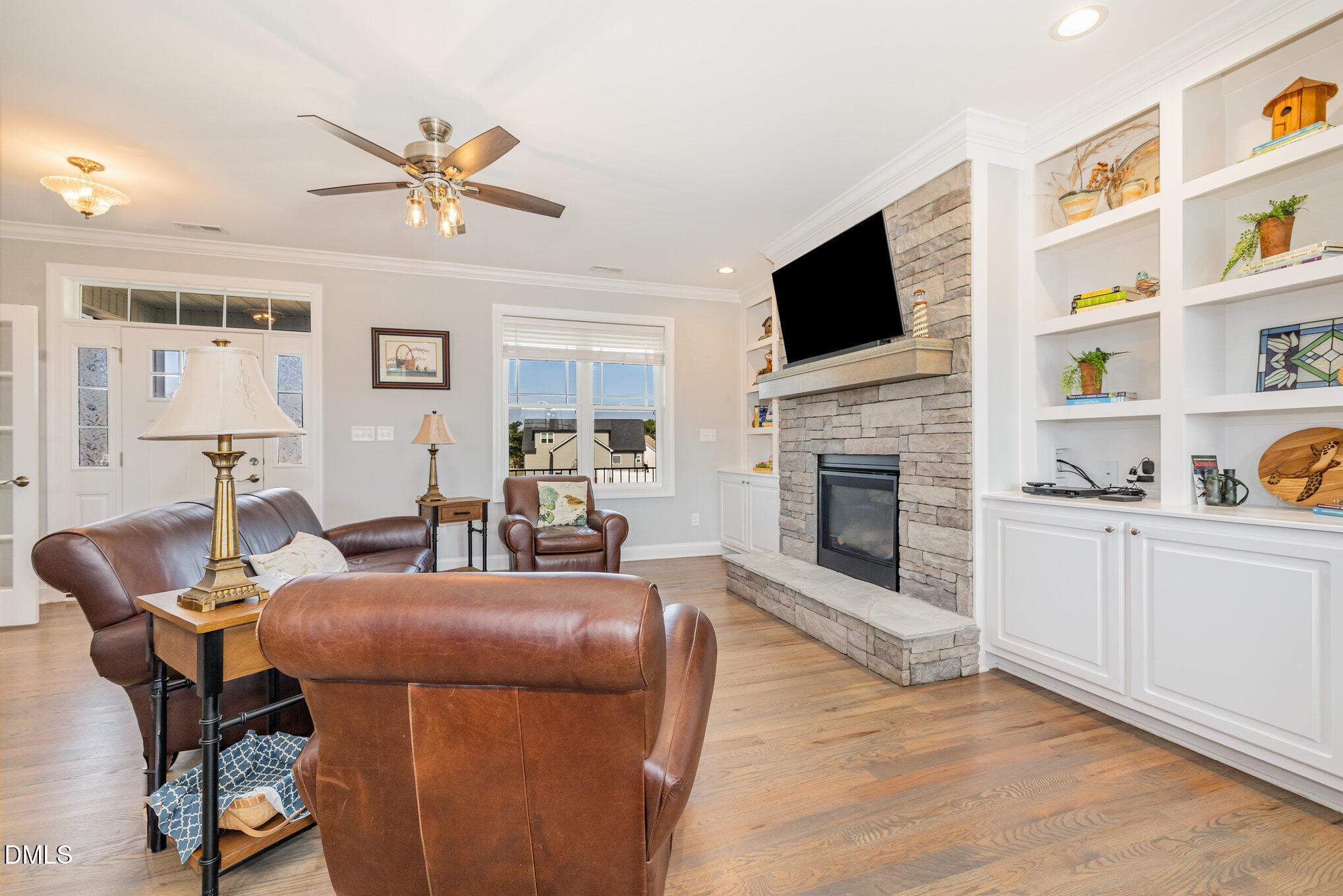 17 Kiowa Court Willow Spring, NC 27592 - Photo 4 of 27 a living room with furniture fireplace and flat screen tv