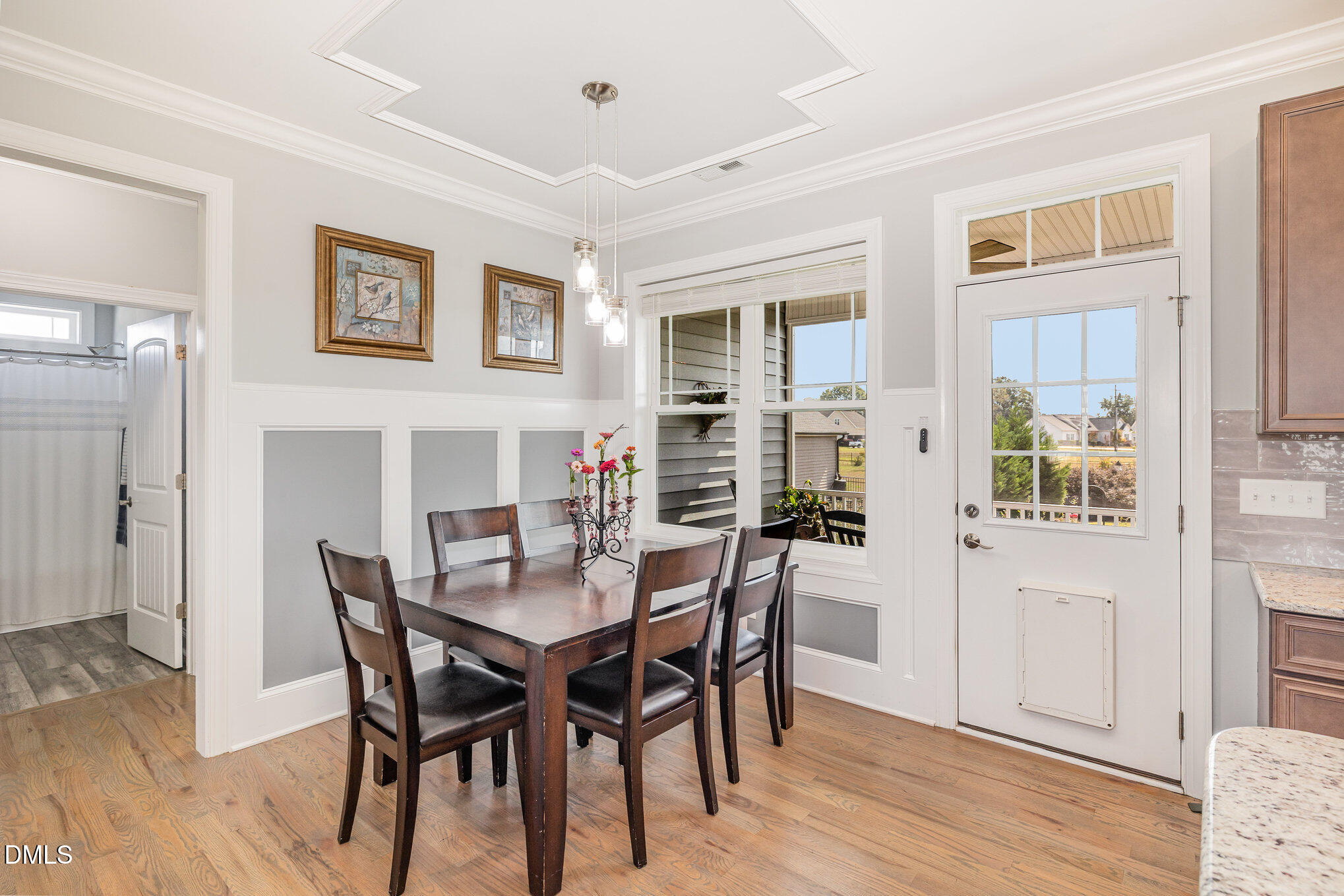 17 Kiowa Court Willow Spring, NC 27592 - Photo 6 of 27 a view of a dining room with furniture and wooden floor