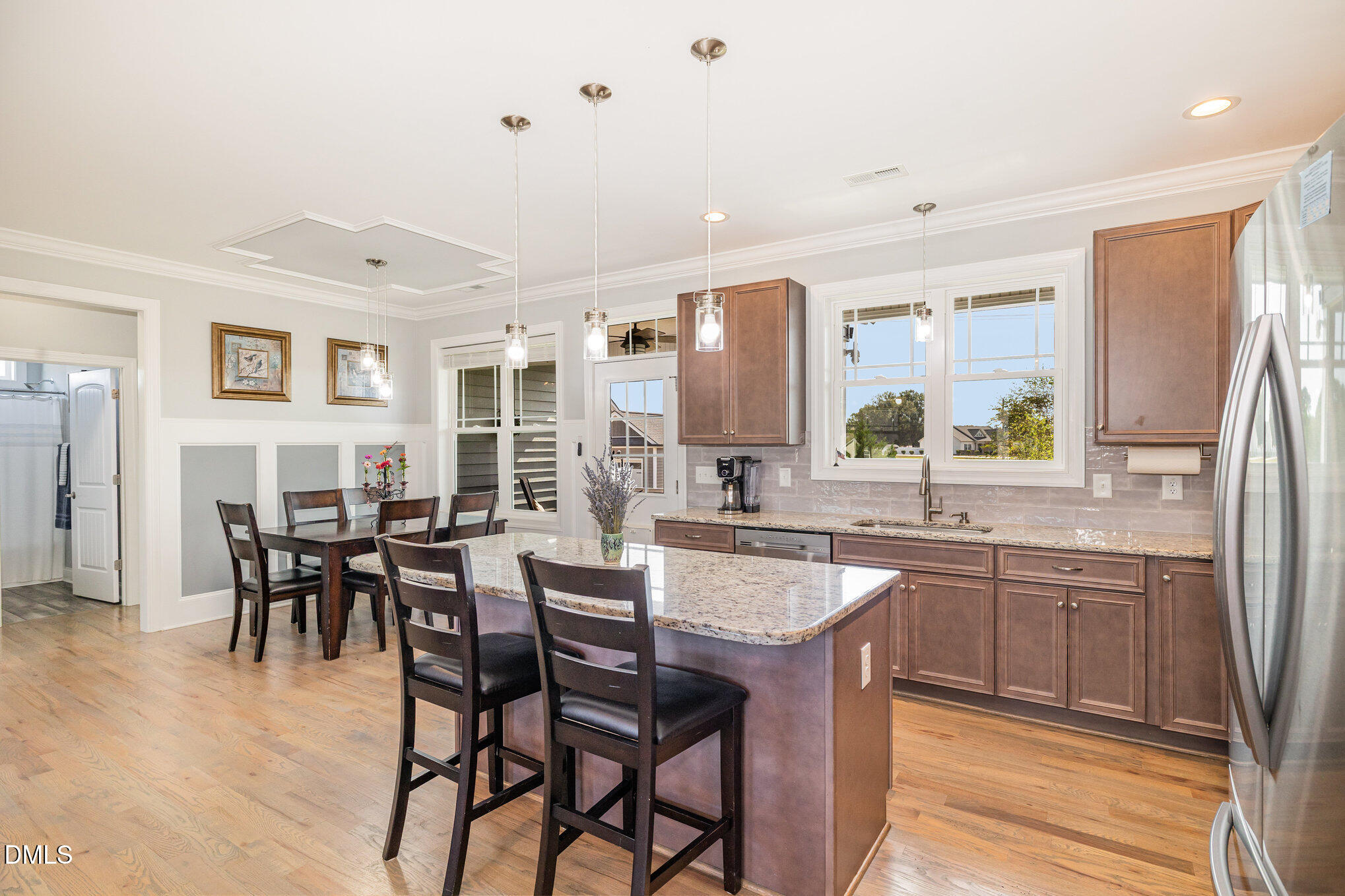 17 Kiowa Court Willow Spring, NC 27592 - Photo 8 of 27 a large kitchen with a table and chairs