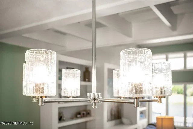 a living room with furniture a clock and a lamp