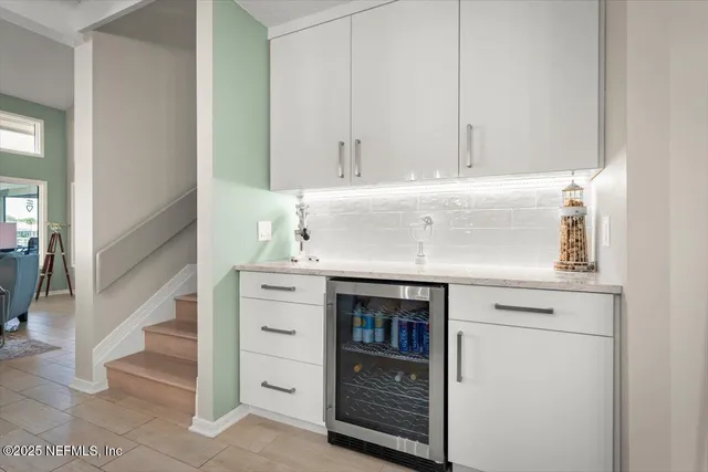 a bedroom with a couch and dresser