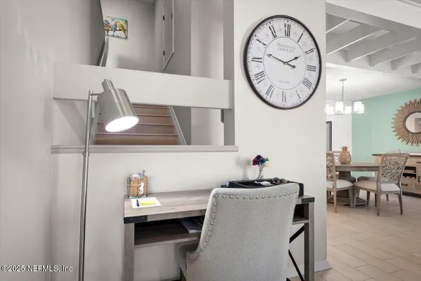 a view of a dining room with furniture window and wooden floor