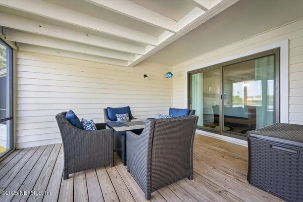a bedroom with two beds and a large window