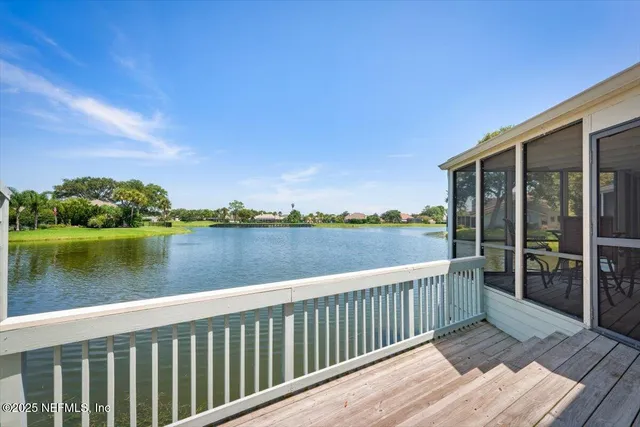 a bedroom with a bed and a table in it