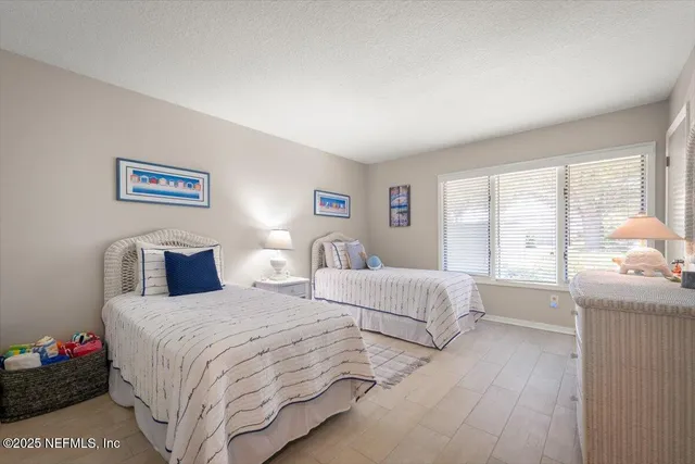a bathroom with a double vanity sink mirror and shower