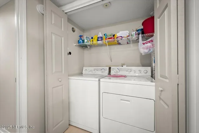 a view of a bedroom with a bed