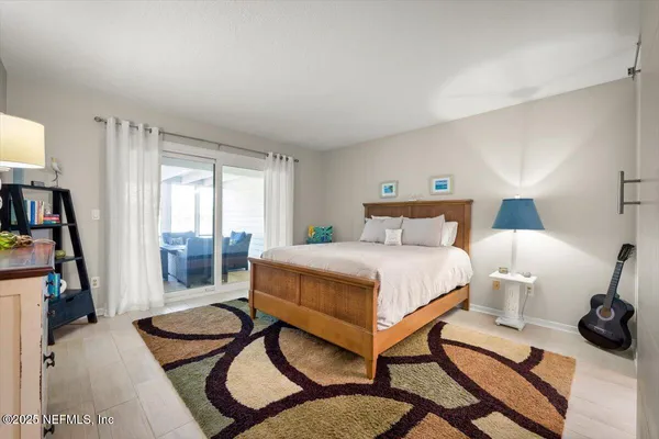 a bedroom with a bed and a cabinets