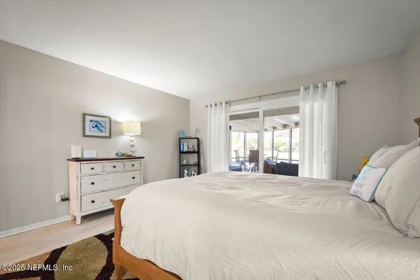 a white bath tub sitting next to a white toilet