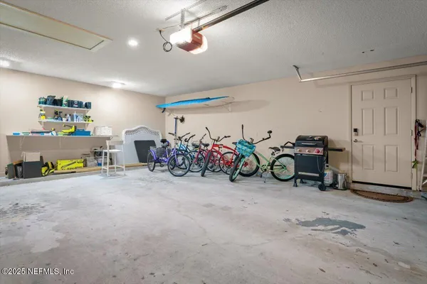 a view of a garage with a bike and car
