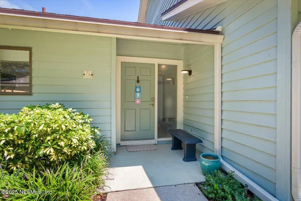 a view of kitchen with cabinets