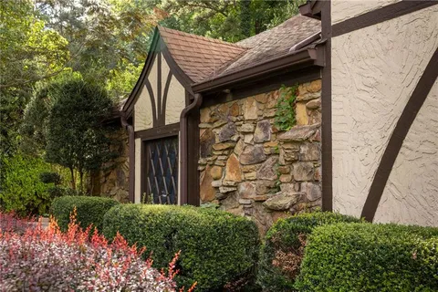 a view of a wooden door and a yard