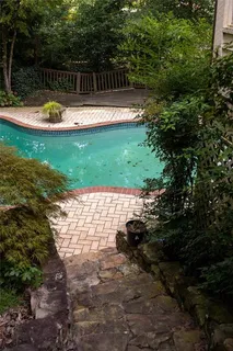 a view of swimming pool with a yard