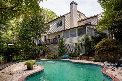 a front view of house with yard and outdoor seating