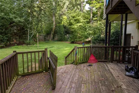 a view of deck with wooden floor and outdoor seating
