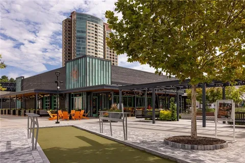 a view of a house with backyard porch and sitting area