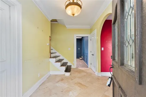 a view of a hall way with furniture