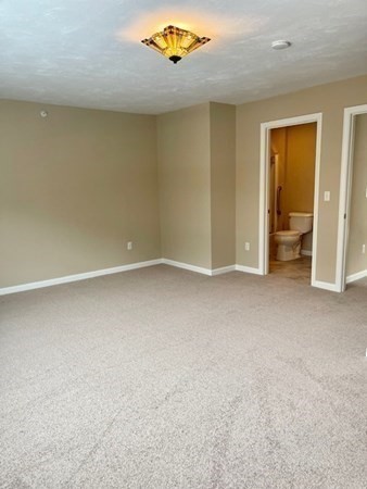113 Dudley Road, Unit 113 Berlin, MA 01503 - Photo 12 of 17 an empty room with closet